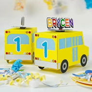 Cocomelon party favors with personalized treat boxes and kids birthday setup