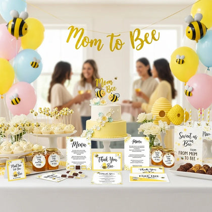 Mom to Bee baby shower party table with bee cake, yellow decorations, balloons, and sweet treats for mom to be