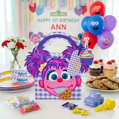Birthday party setup with Abby Cadabby Sesame Street-themed decorations and cookies.