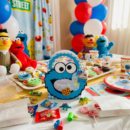 Sesame Street-themed birthday party with cookies, decorations, and character plush toys.