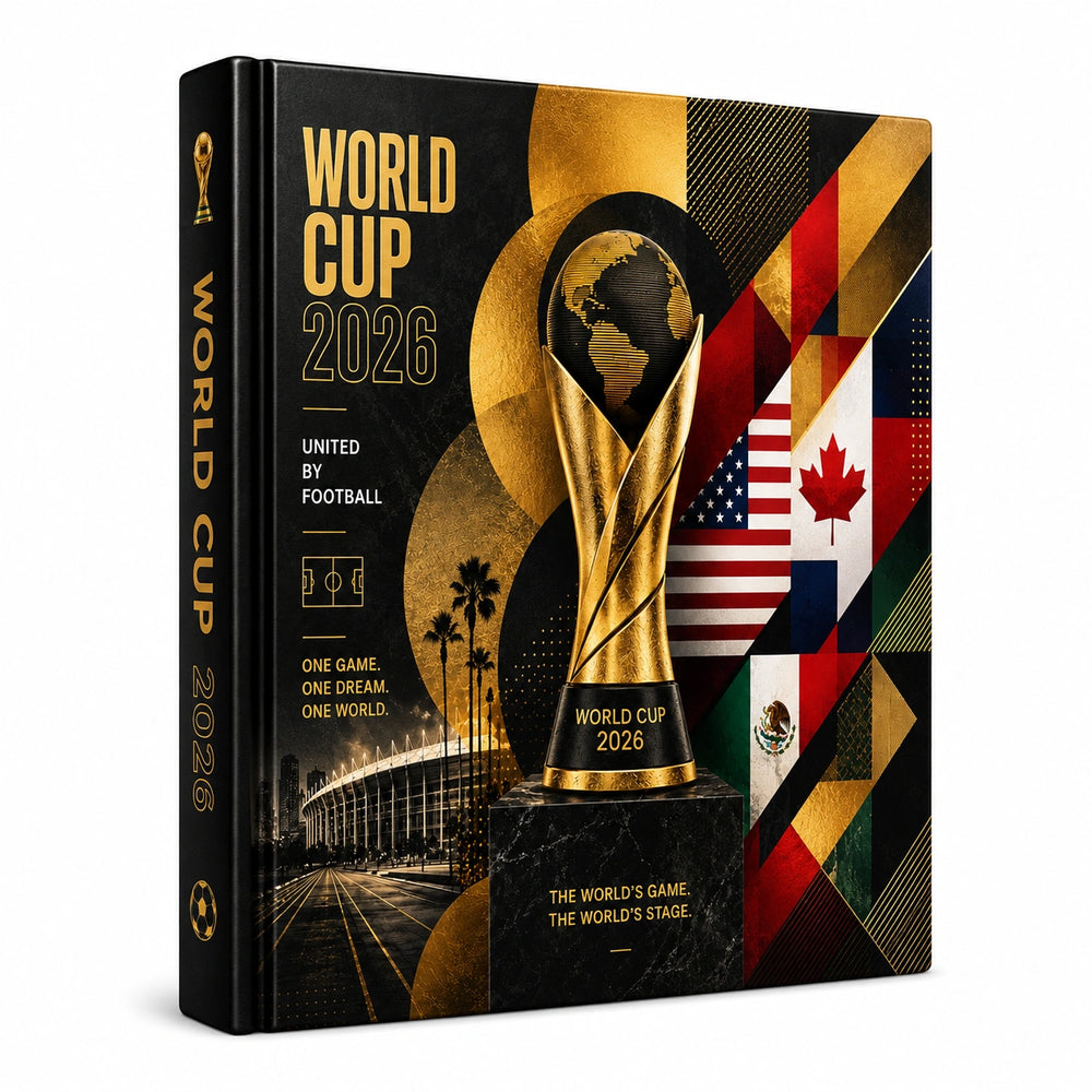 A hardcover book or box cover for World Cup 2026, shown at a slight angle against a plain white background. The cover is predominantly black with large gold typography, a gold FIFA trophy graphic, and a collage of national flags on the right side.