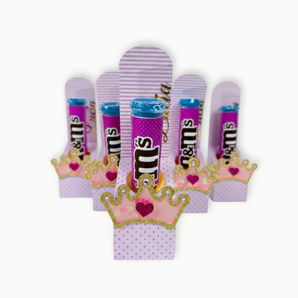 Set of M&M's candy bars with princess-themed packaging on a white background