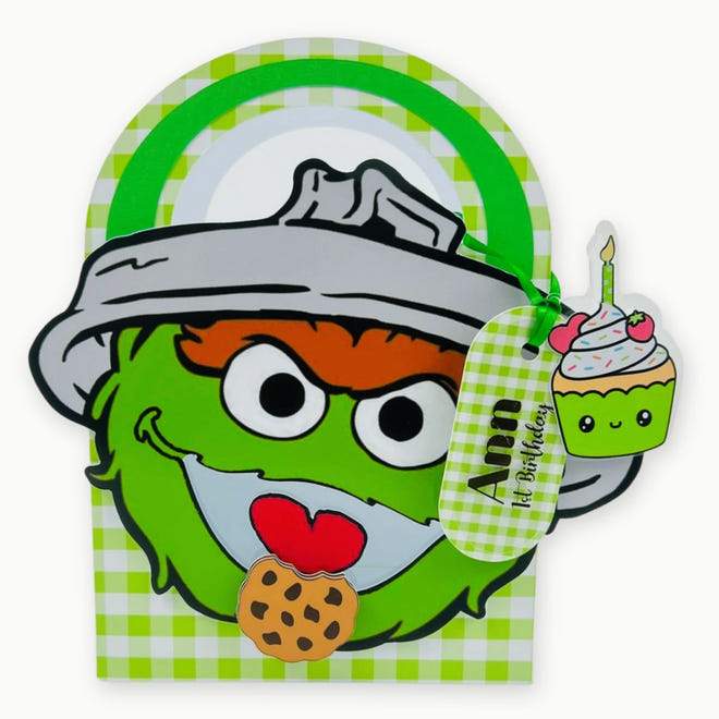 Oscar the Grouch Party Favor Box  Cartoon character with a checkered background and a cupcake with a candle.