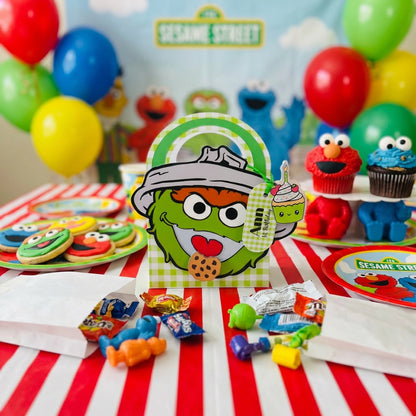 Sesame Street-themed birthday party with colorful balloons, cookies, and decorations.
