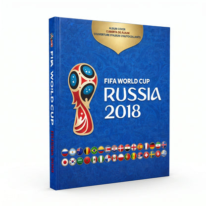 FIFA World Cup Russia 2018 album cover shown as a 3D book mockup on a white background. The cover is predominantly blue with a gold crest badge at the top, the official tournament logo in the center, and the text 'FIFA WORLD CUP RUSSIA 2018' in white.