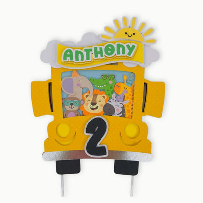 Birthday cake topper with cartoon animals and the name 'Anthony' on a white background